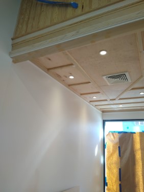 close up of trim where dropped ceiling transitions to tongue and groove beadboard